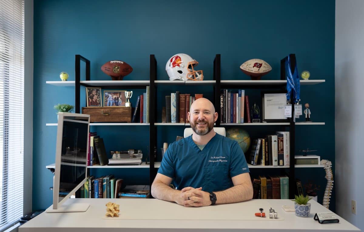 Dr. Bobby Koser, DC, chiropractic physician, at his desk at HealthSpine Chiropractic in Carrollwood, Tampa